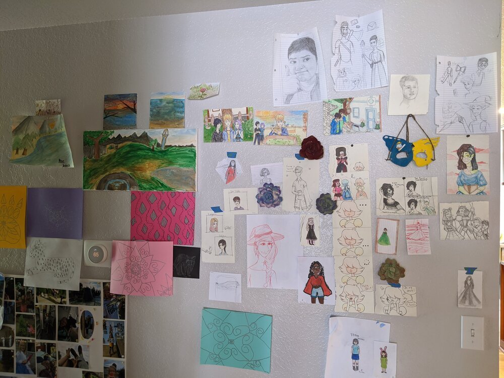 The art wall that’s been growing at my house during quarantine! Only one of these drawings (a raccoon fella) is mine—the other creations are the folks I live with. &lt;3 It makes me smile every time I pass it to grab another cup of coffee.  [Photo: various drawings and paintings, including Bob’s Burgers/Adventure Zone/Steven Universe/Raven Cycle fanart, Breath of the Wild landscapes, and felt flowers]